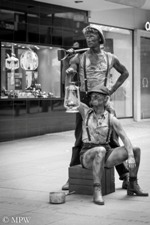 Queen Street Auckland city, Coal men, street art, black and white photo by Mike Wheelton